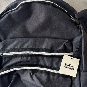 NWT Black Unisex BackPack with Multiple Front Side Zippers. NEW ❤️ with Tags.